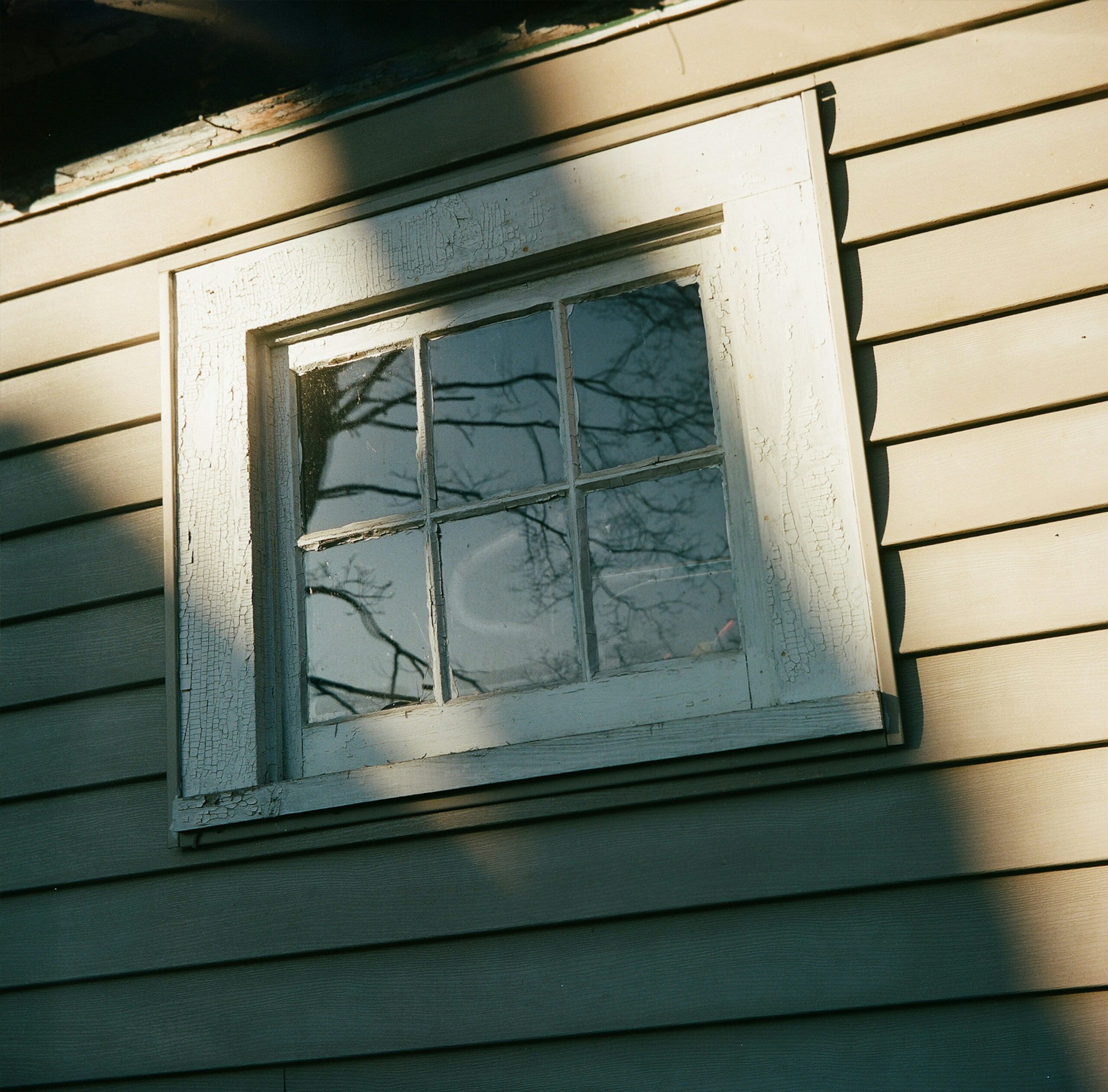 Close up of a broken double glazing window emphasizing the shattered glass texture