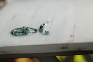 a couple of bracelets sitting on top of a white table