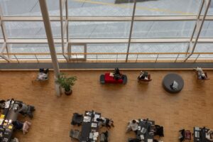 People working at desks in a modern office space.