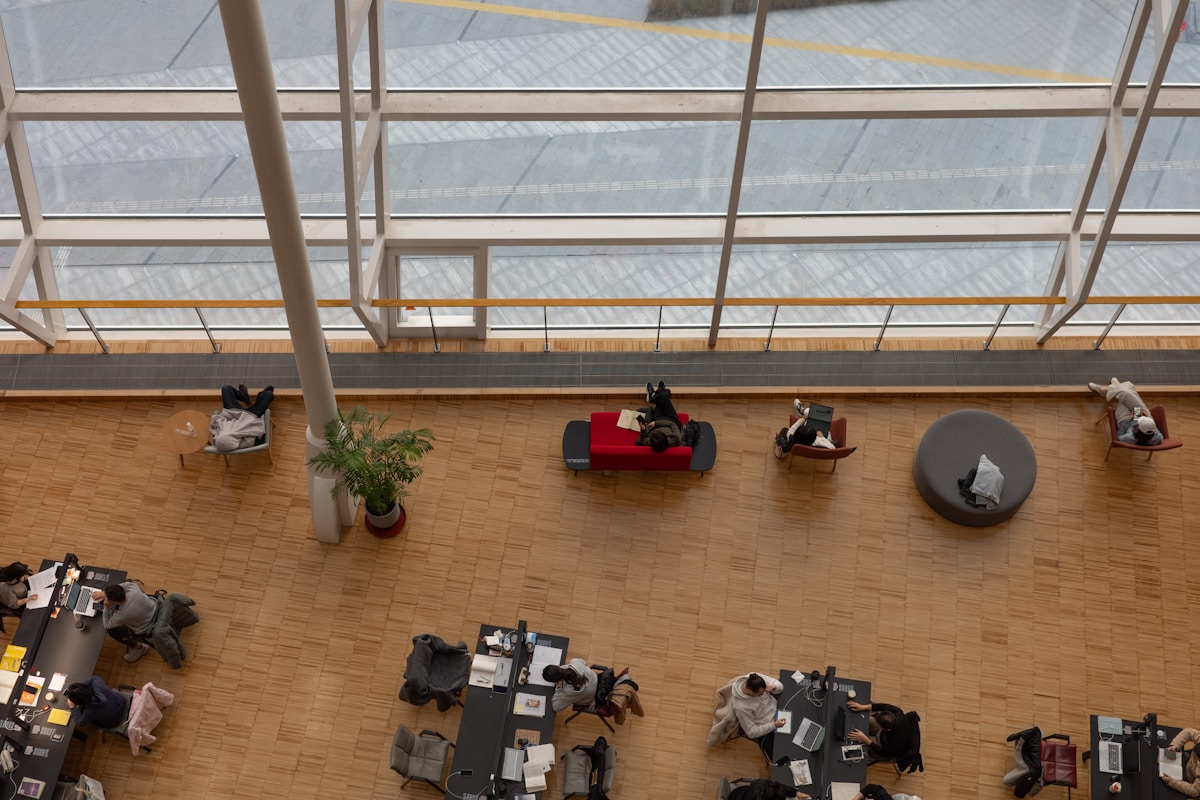 People working at desks in a modern office space.