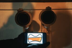 a person holding a cell phone in their hand